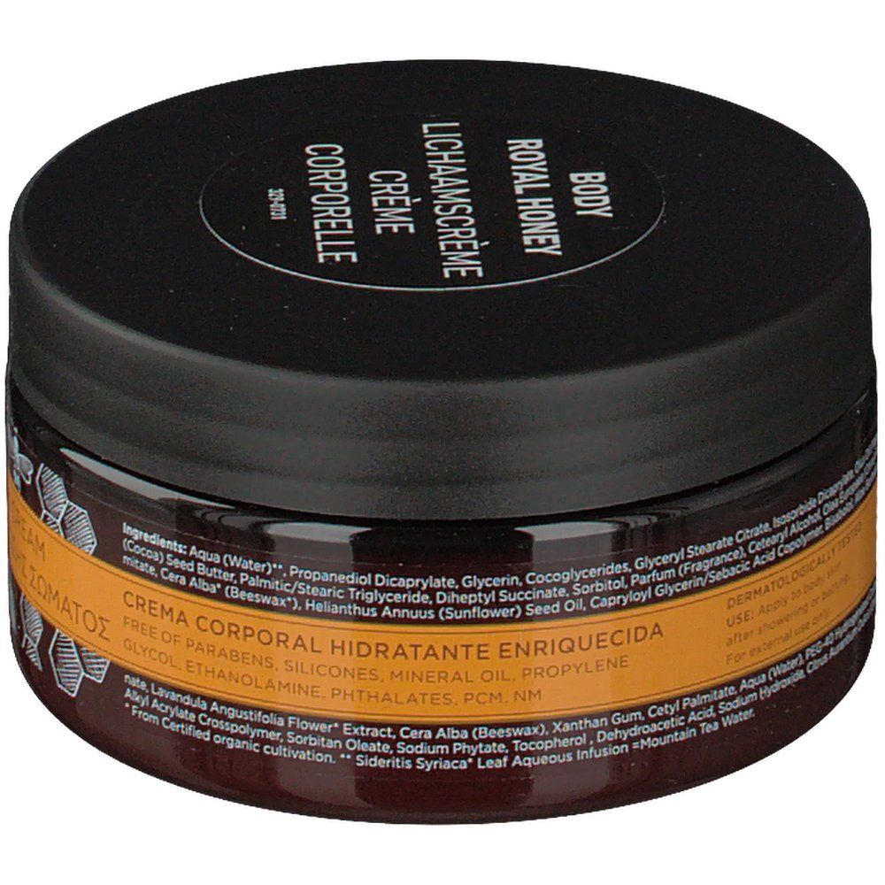 Pot rond Apivita Body Creme Hydratante Royal Honey. Couvercle noir, verre brun. Texte au dos: ingrédients, testé dermatologiquement.