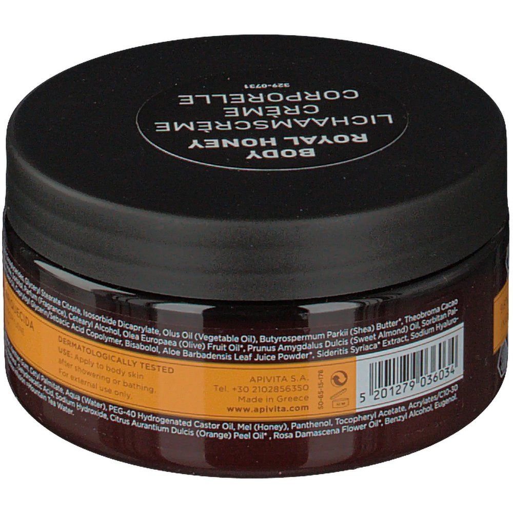 Pot rond Apivita Body Creme Hydratante Royal Honey. Couvercle noir, verre brun. Texte au dos: ingrédients, testé dermatologiquement.