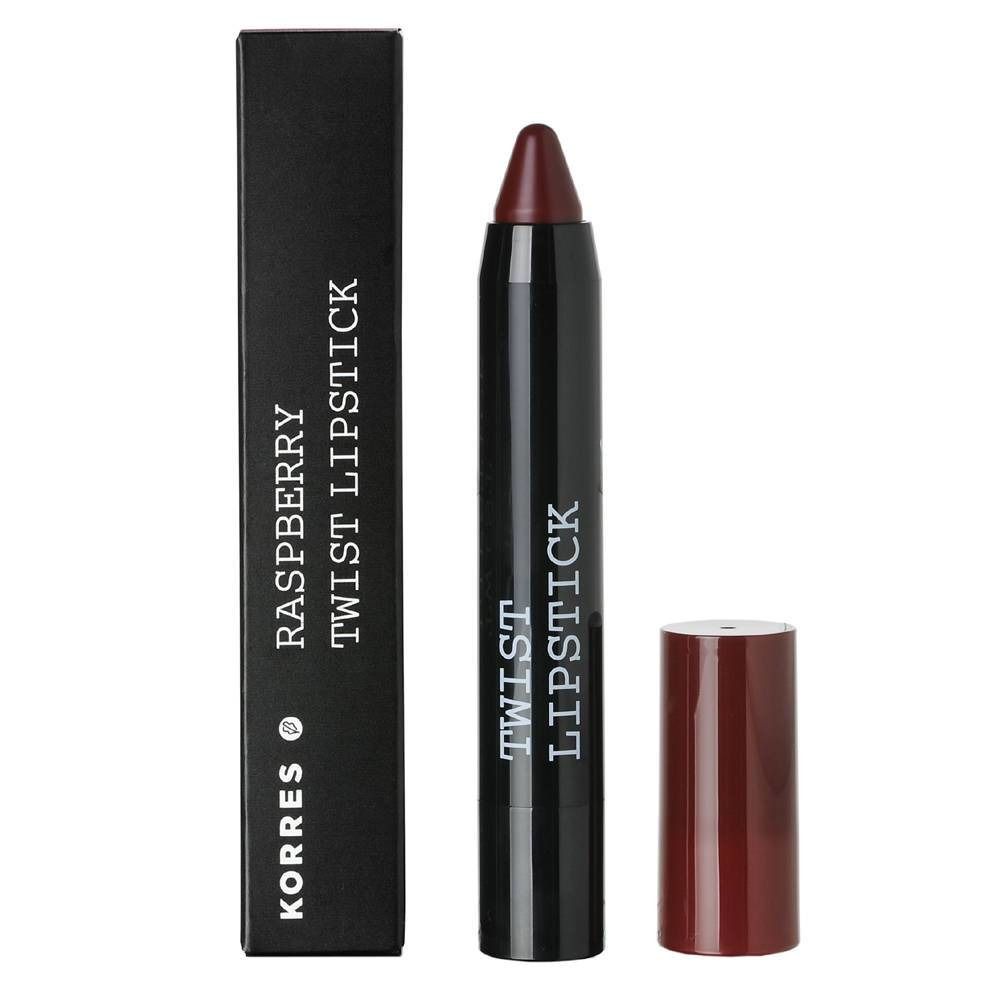 Rouge à lèvres Korres Himbeere Twist. Bâton de rouge à lèvres rouge foncé avec étui noir et capuchon séparé. Emballage noir avec texte.