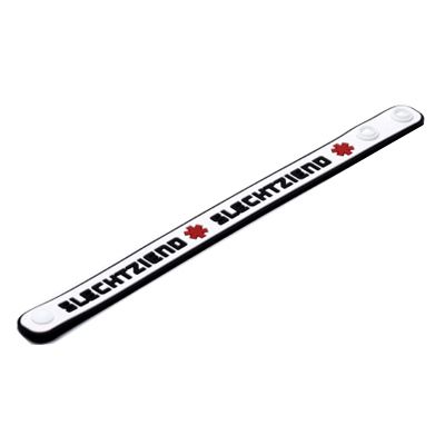 Bracelet en silicone blanc, bord noir. Inscription SLECHTZIEND. Symbole croix rouge. Deux boutons blancs.