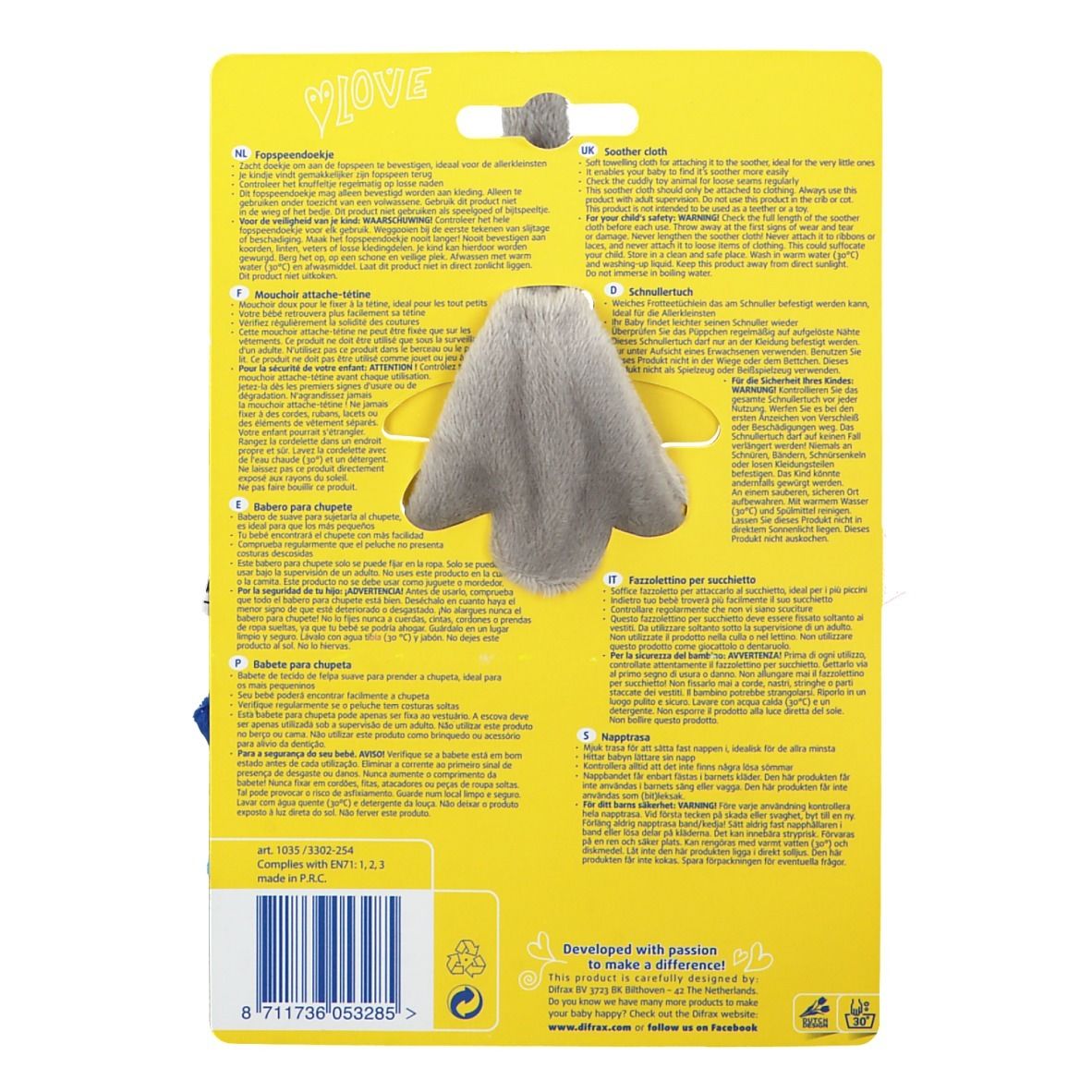 Dos de l'attache-sucette sur fond jaune. Partie en tissu gris au centre, texte en plusieurs langues.