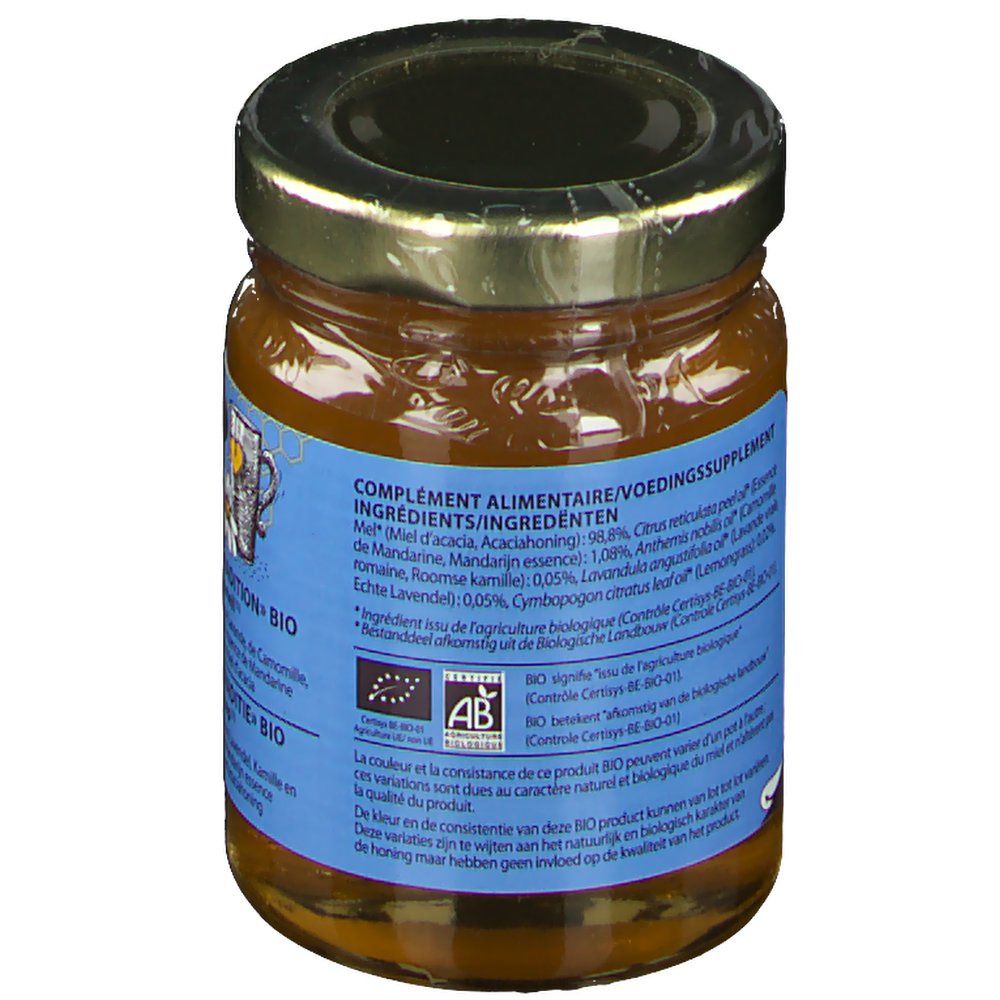 Achterkant van de honingpot. Blauw etiket met ingrediëntenlijst en bio-certificering. Tekst: complément alimentaire/voedingssupplement.