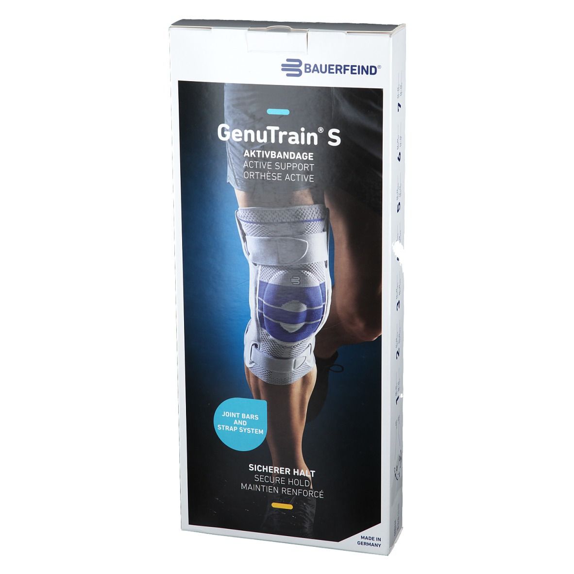 Orthèse de genou GenuTrain S sur une jambe. Gros plan de l'orthèse avec rails latéraux et système de sangles.
