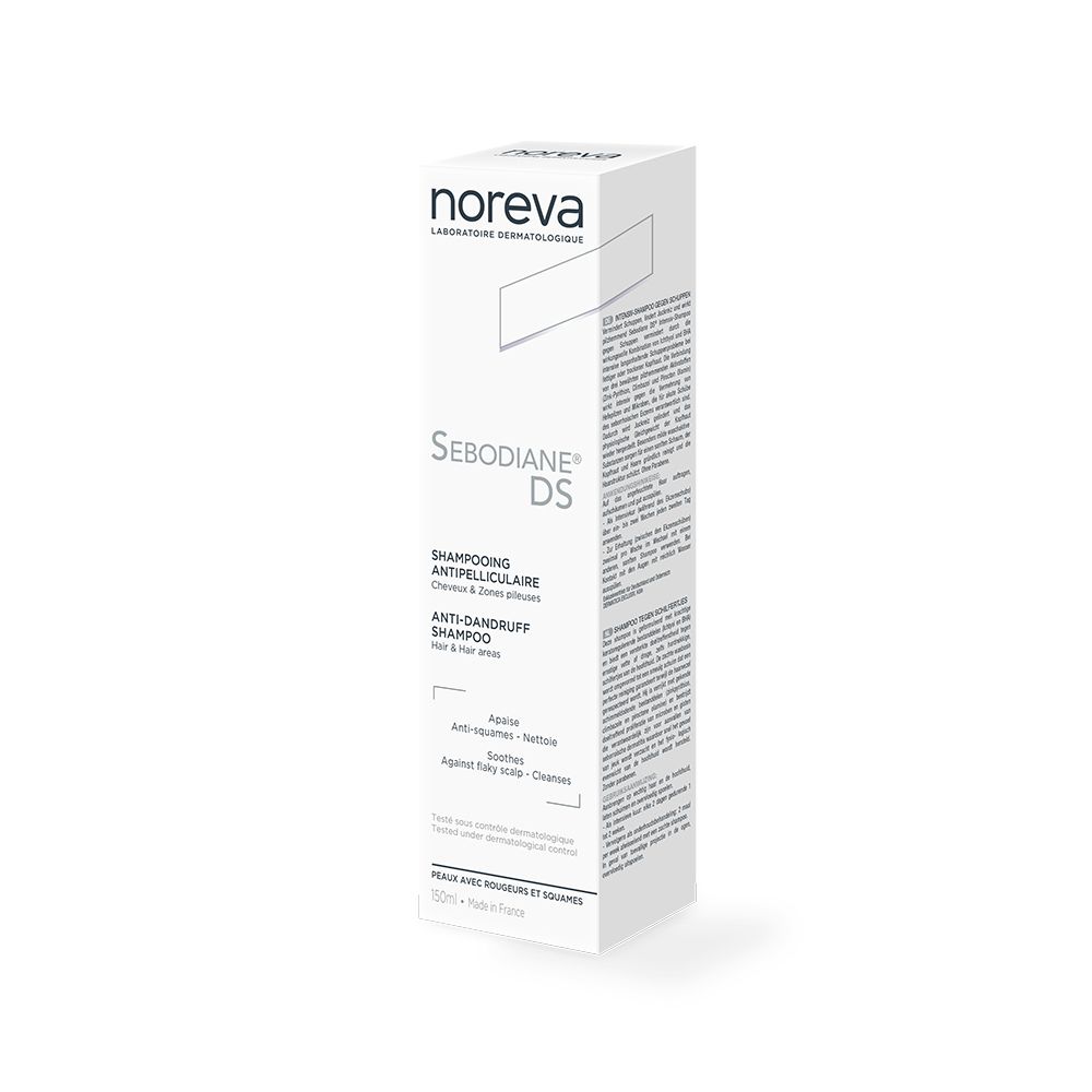 Witte doos shampoo. Opschrift: Sebodiane DS, Anti-roos shampoo. Merk: Noreva.