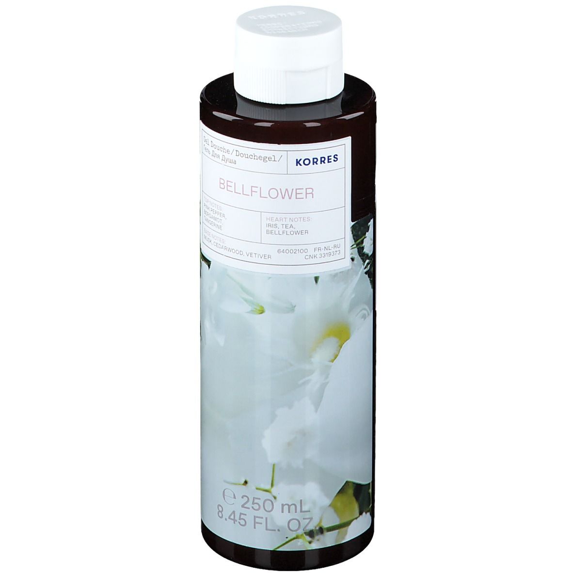Flacon marron avec bouchon blanc. Étiquette avec nom du produit et motif floral. Contenance : 250 ml.