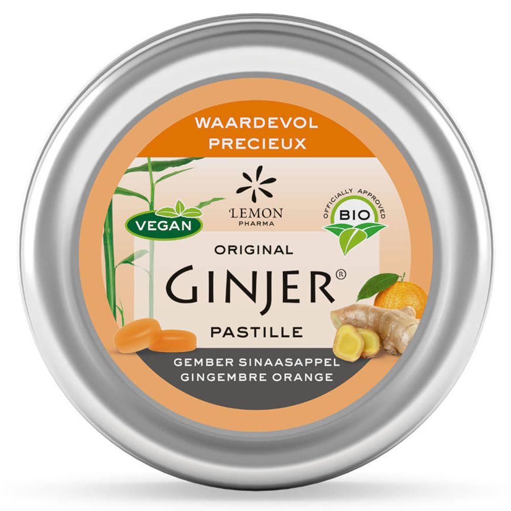 Ronde doos met Ginjer pastilles. Oranje etiket met productnaam, afbeeldingen van gember en sinaasappel, bio-keurmerk.