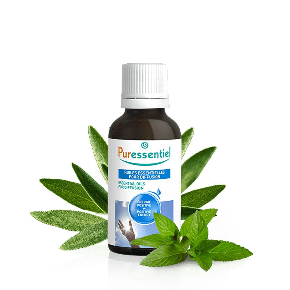Bruine glazen fles met witte dop, omringd door bladeren. Opschrift: Puressentiel, Huiles Essentielles, Energie Positive.