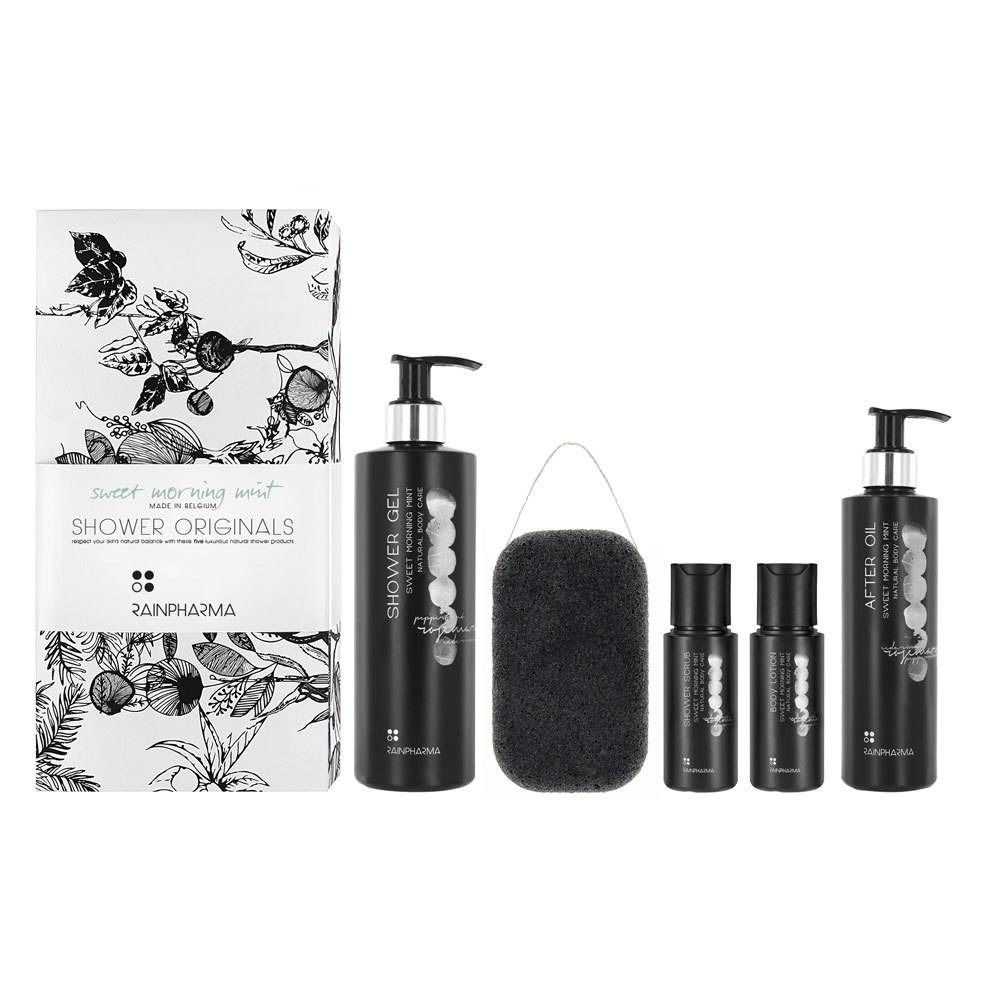 Ensemble avec gel douche, huile après-douche, éponge et petites bouteilles. Flacons noirs avec texte. Emballage floral.