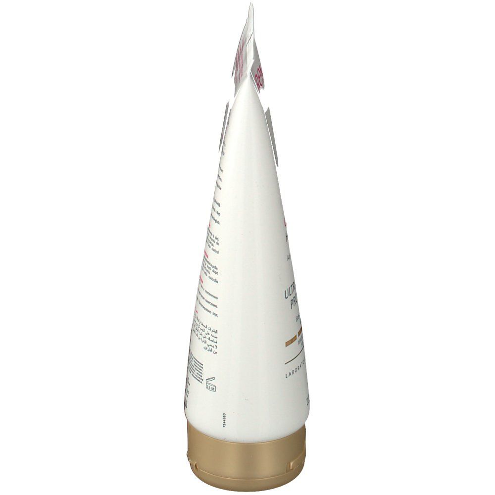 Zijaanzicht van de TOPICREM Ultra Hydratant progressive Bräune tube. Wit, roze en bruine details. Gouden sluiting.