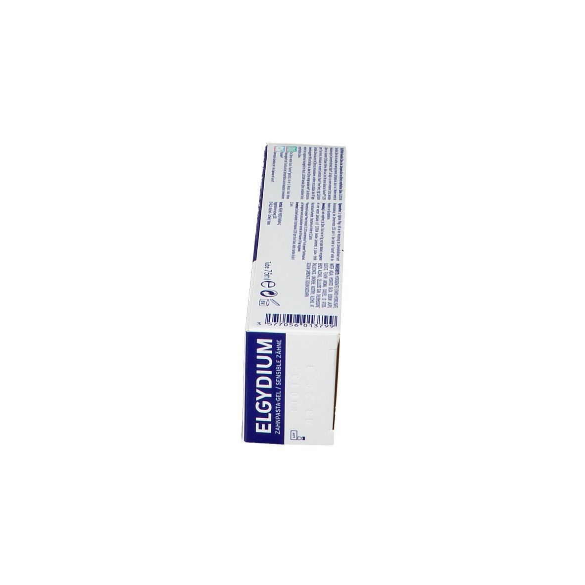 Boîte de dentifrice, vue latérale. Inscription : ELGYDIUM. Texte et symboles sur fond blanc.