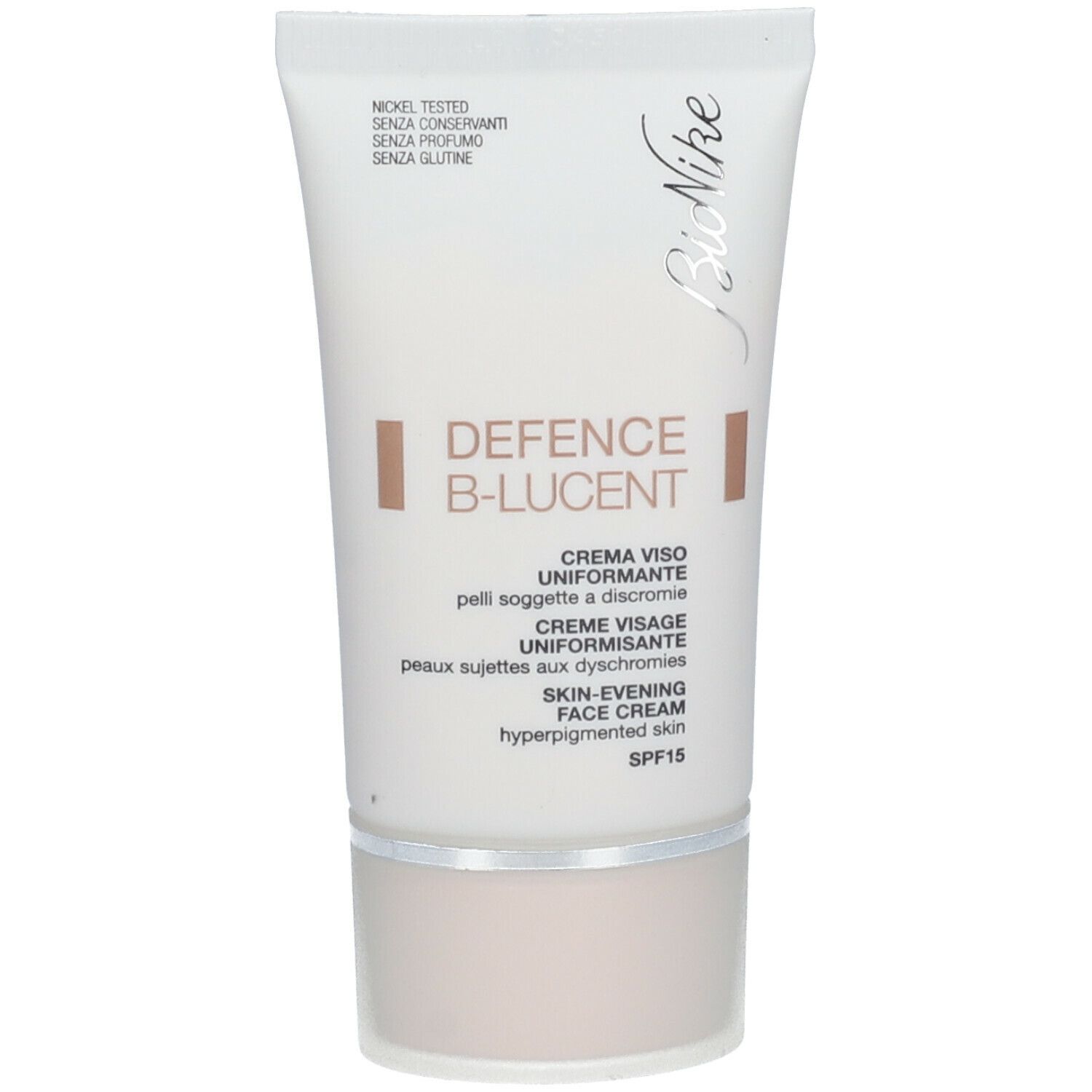 Witte crèmetube met productnaam en SPF 15. Merk Bionike. Tekst: DEFENCE B-LUCENT, gezichtscrème.