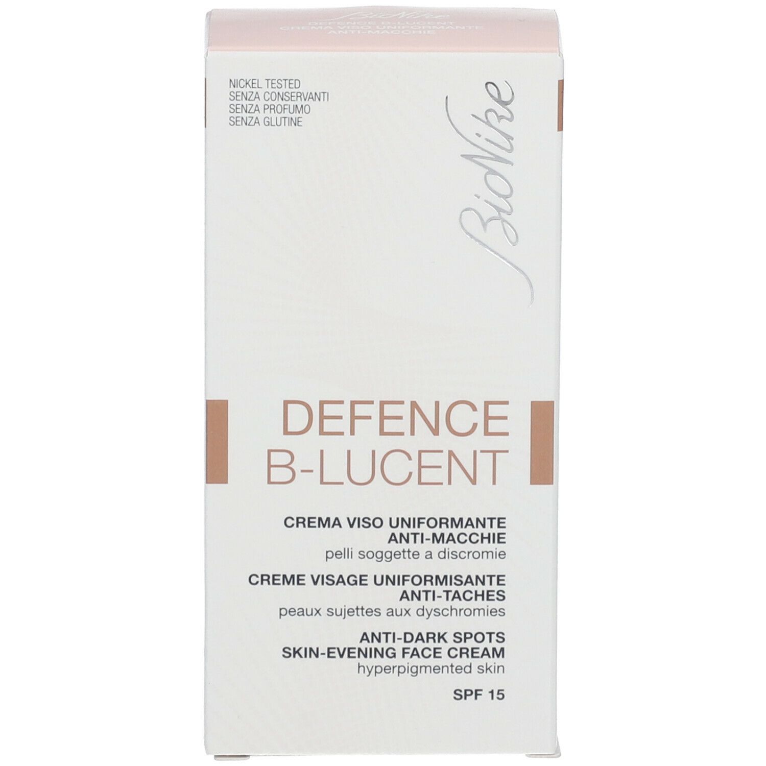 Productverpakking, wit. Tekst: DEFENCE B-LUCENT, gezichtscrème, SPF 15. Merk Bionike. Getest op nikkel.