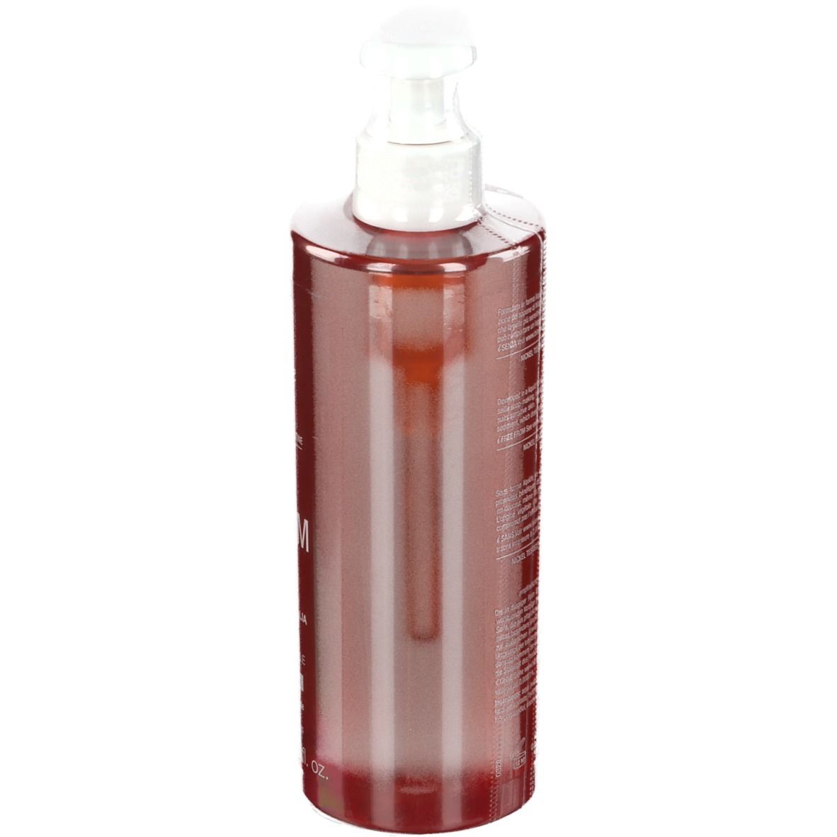 Flacon rouge transparent avec pompe blanche. Vue latérale. Texte peu lisible.