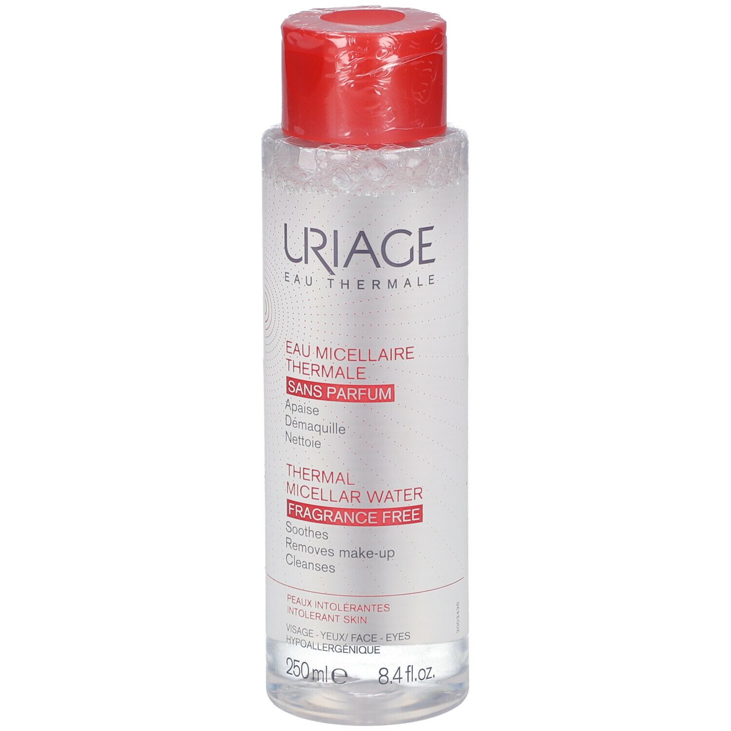 Flacone trasparente con tappo rosso. Scritte: Uriage Eau Thermale, Thermal Micellar Water, sans parfum, fragrance free.