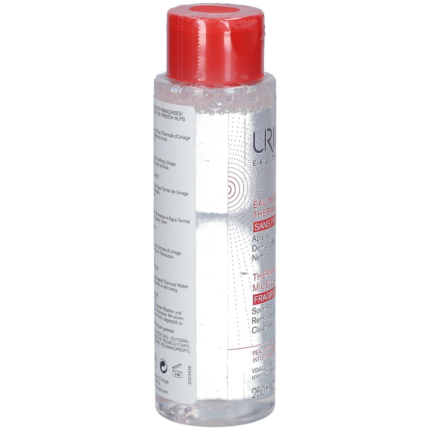 Flacone trasparente con tappo rosso. Scritte: Uriage Eau Thermale. Retro con informazioni multilingue sul prodotto.