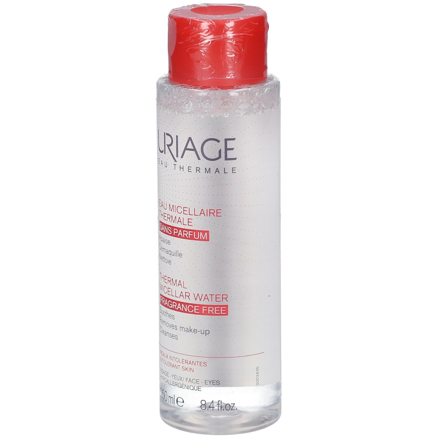 Flacone trasparente con tappo rosso. Scritte: Uriage Eau Thermale, Thermal Micellar Water, sans parfum, fragrance free.