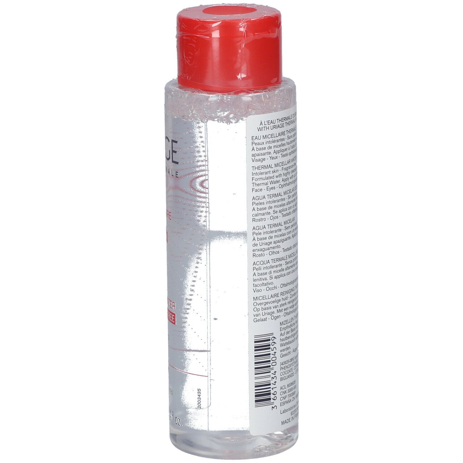 Flacone trasparente con tappo rosso. Scritte: Uriage Eau Thermale. Retro con informazioni e codice a barre.