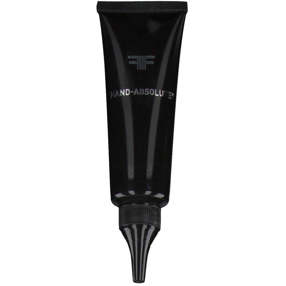 Tube noire avec nom du produit et logo. Embout fin. Texte: HAND-ABSOLUTE.