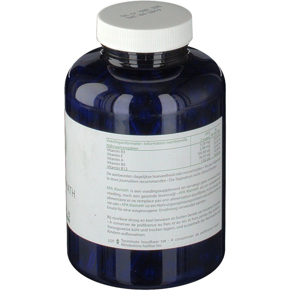 Flacon bleu avec bouchon blanc. Étiquette avec informations nutritionnelles. Texte multilingue.