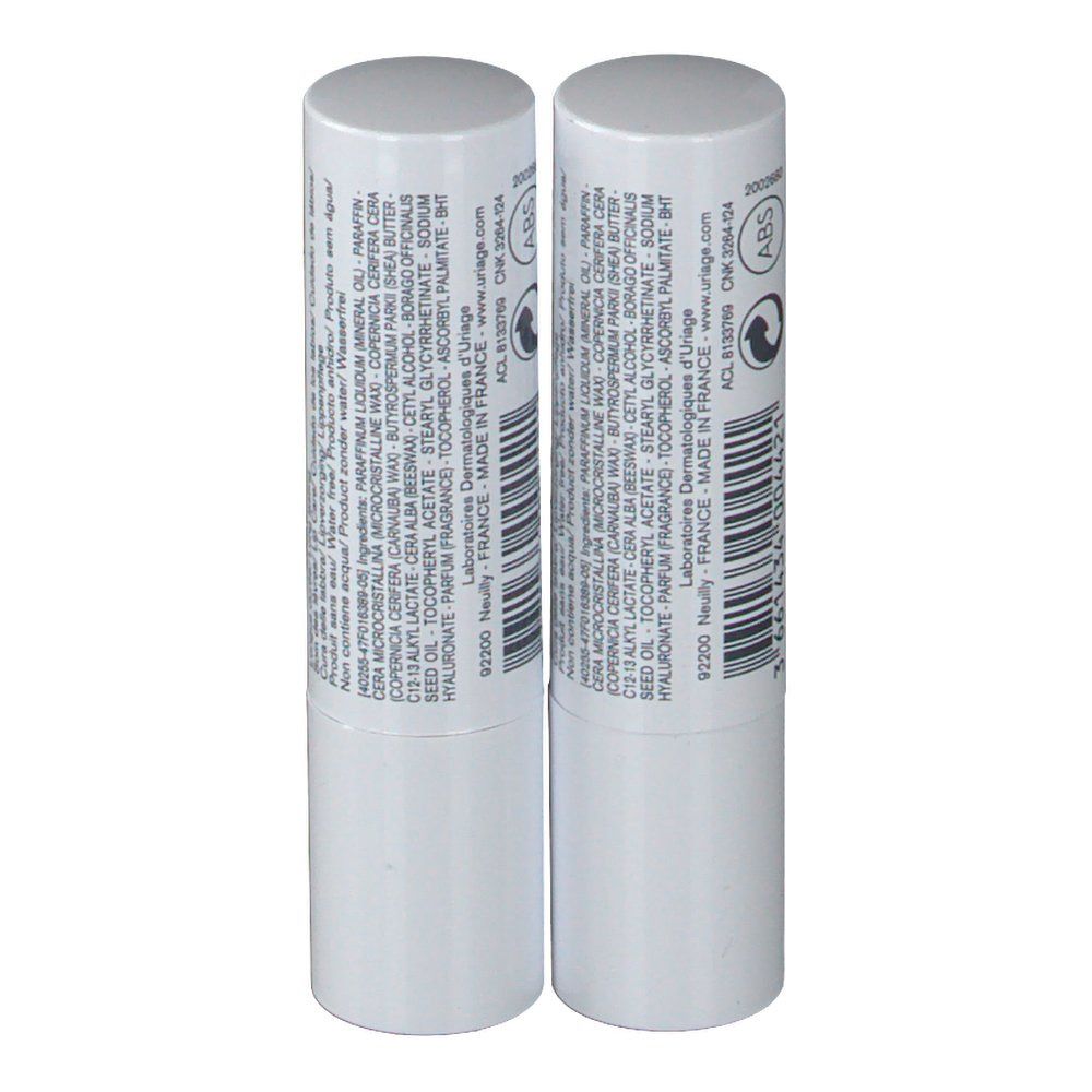 Deux sticks à lèvres blancs. Inscription: URIAGE, ingrédients, code-barres, logo. Fabriqué en France.
