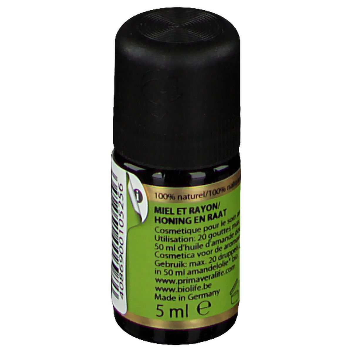 Kleine glazen fles met zwarte dop. Groen etiket met tekst: Miel et rayon/Honing en raat. Volume: 5 ml. Gemaakt in Duitsland.