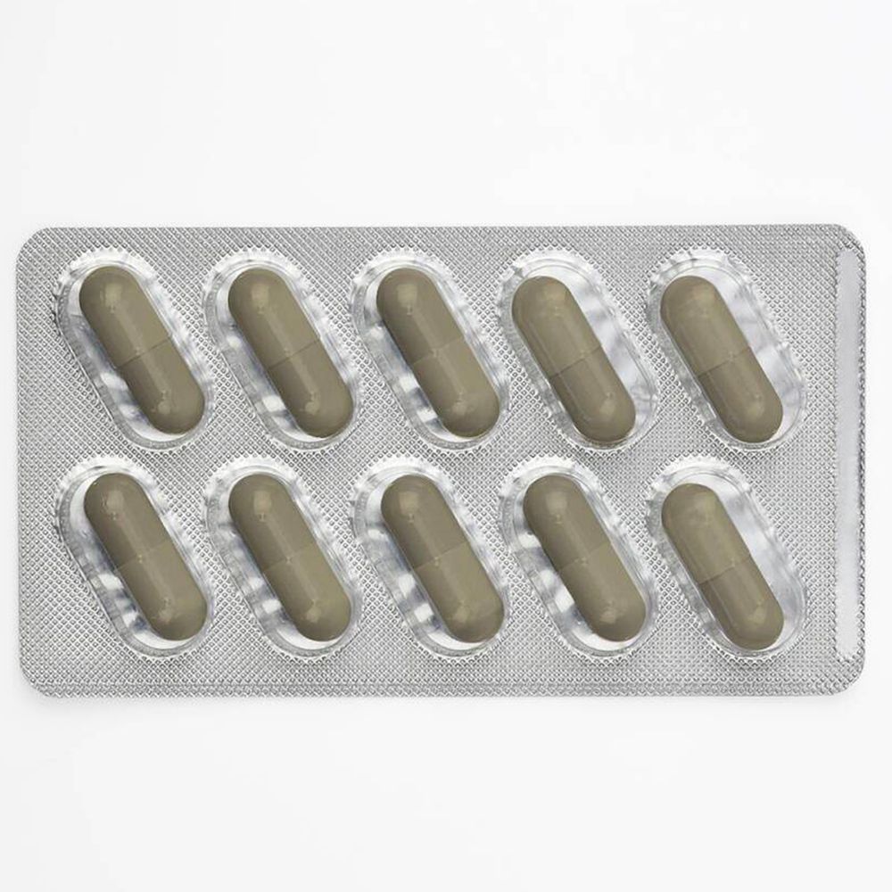 Blisterverpakking met 8 capsules. Grijze capsules in een zilveren blisterverpakking. Afzonderlijke capsules zichtbaar.