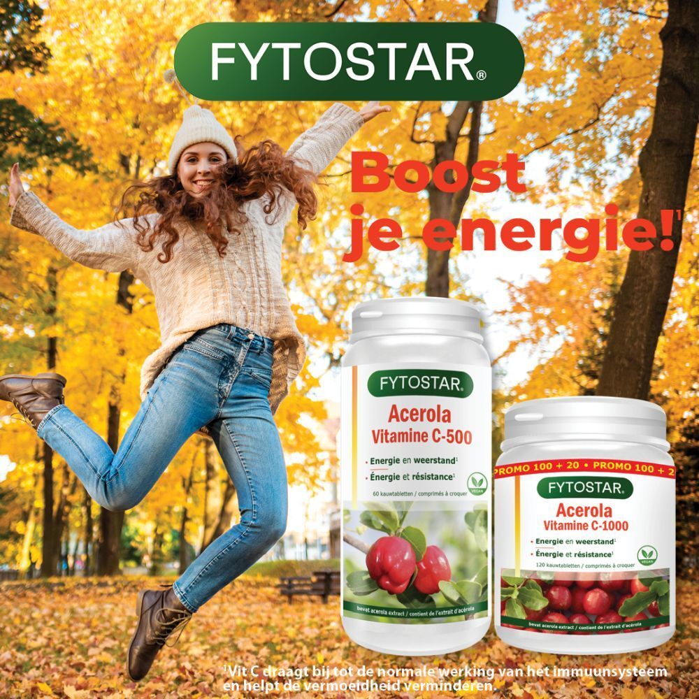 Reclamebeeld. Vrouw voor herfstbladeren. Twee Fytostar-producten: Acerola C-500 en C-1000. Tekst in het Nederlands.