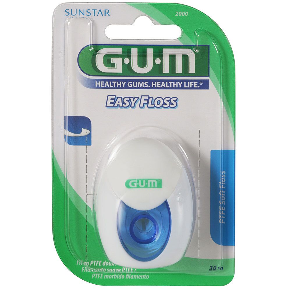 Fil dentaire GUM Easy Floss ciré dans un emballage blister. Bobine blanche avec insert bleu, emballage vert.