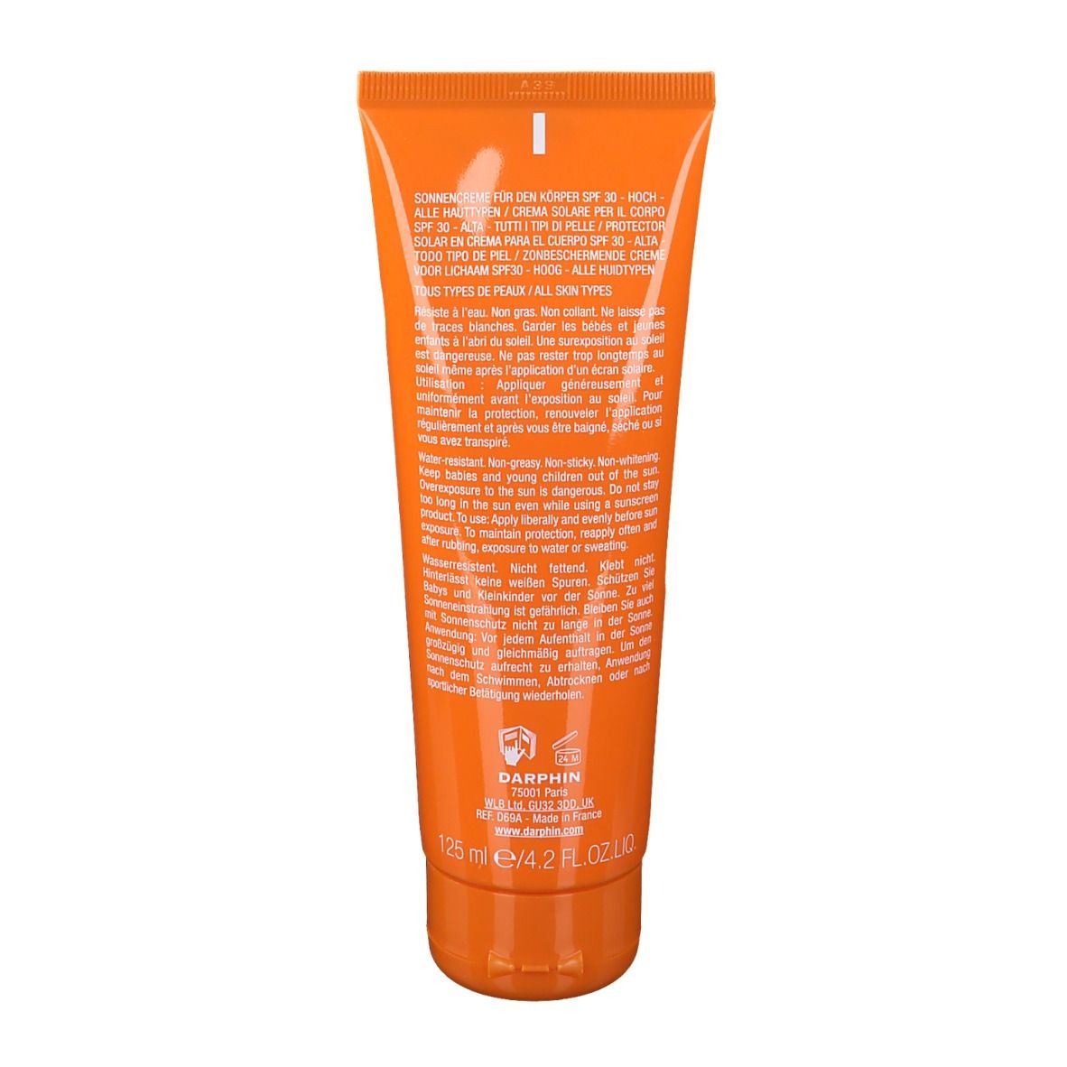 Rückseite der orangefarbenen Tube. Text in mehreren Sprachen, darunter Informationen zur Anwendung und Inhaltsstoffe.
