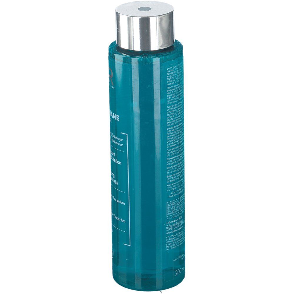 Flacon cylindrique avec bouchon argenté. Liquide bleu visible. Texte sur le flacon. 200ml.