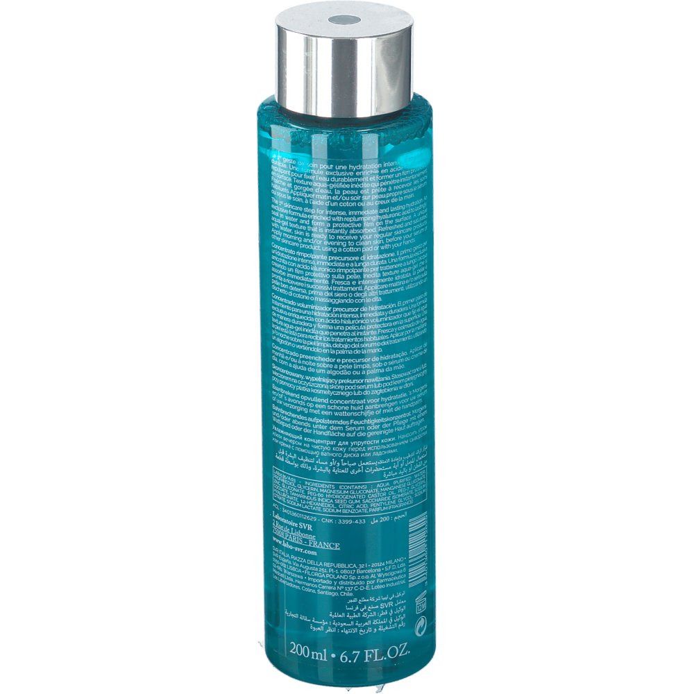 Vue arrière d'un flacon cylindrique avec bouchon argenté. Liquide bleu visible. Texte sur le flacon. 200ml.