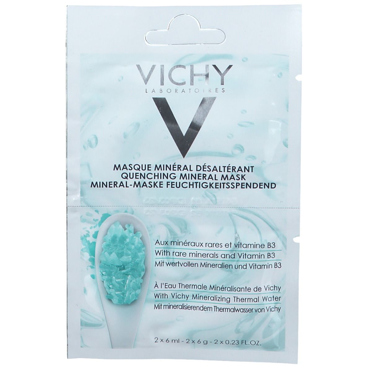 Transparante zak met VICHY-logo en productnaam. Tekst in het Frans, Engels en Duits. Bevat mineralen en vitamine B3.