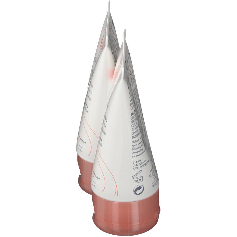 Deux tubes de crème pour les mains, vus de côté. Blancs, avec bouchon rose. Pointe vers le haut. Inscription illisible.