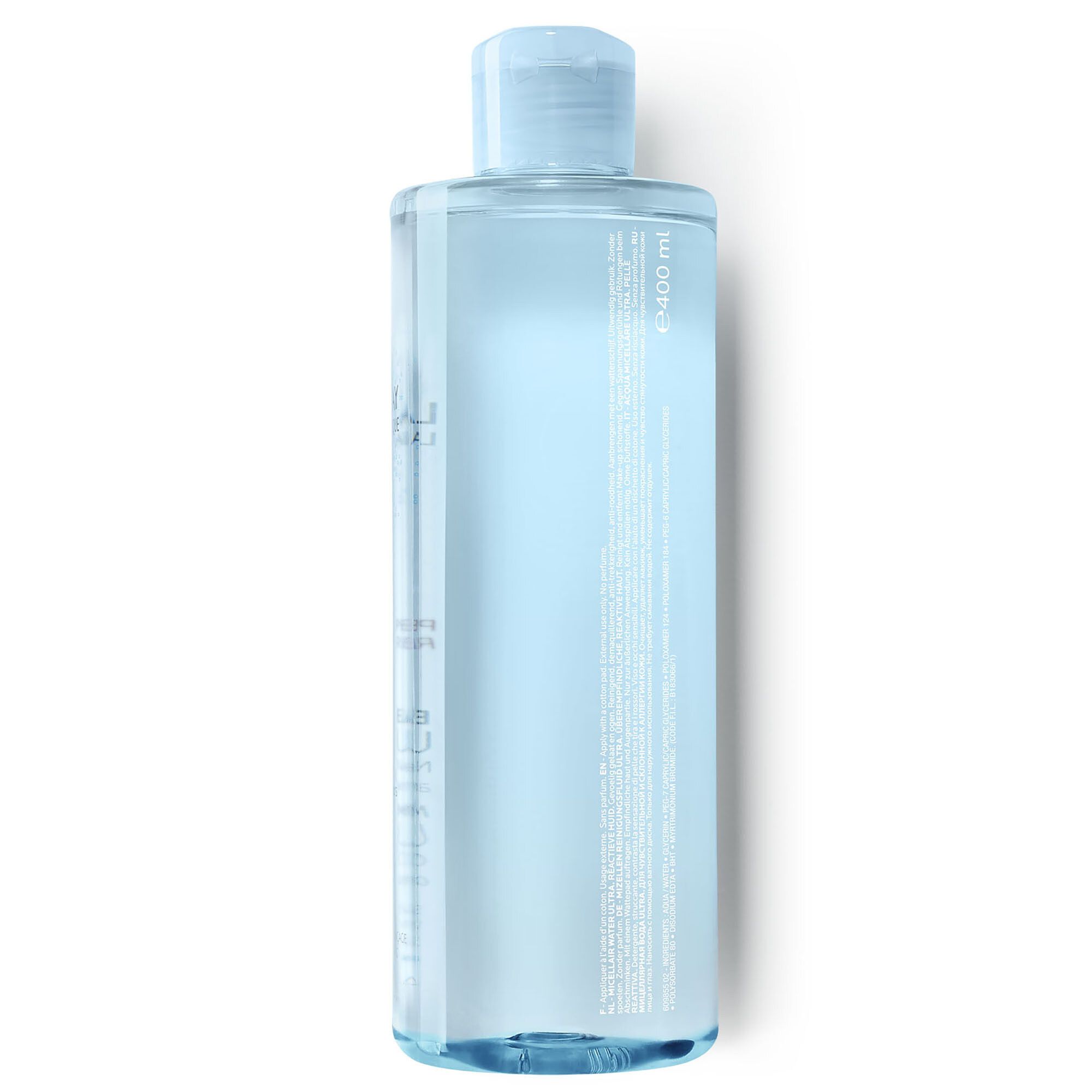 Klare Flüssigkeit in einer zylindrischen Flasche mit blauem Deckel. Aufschrift auf der Flasche.