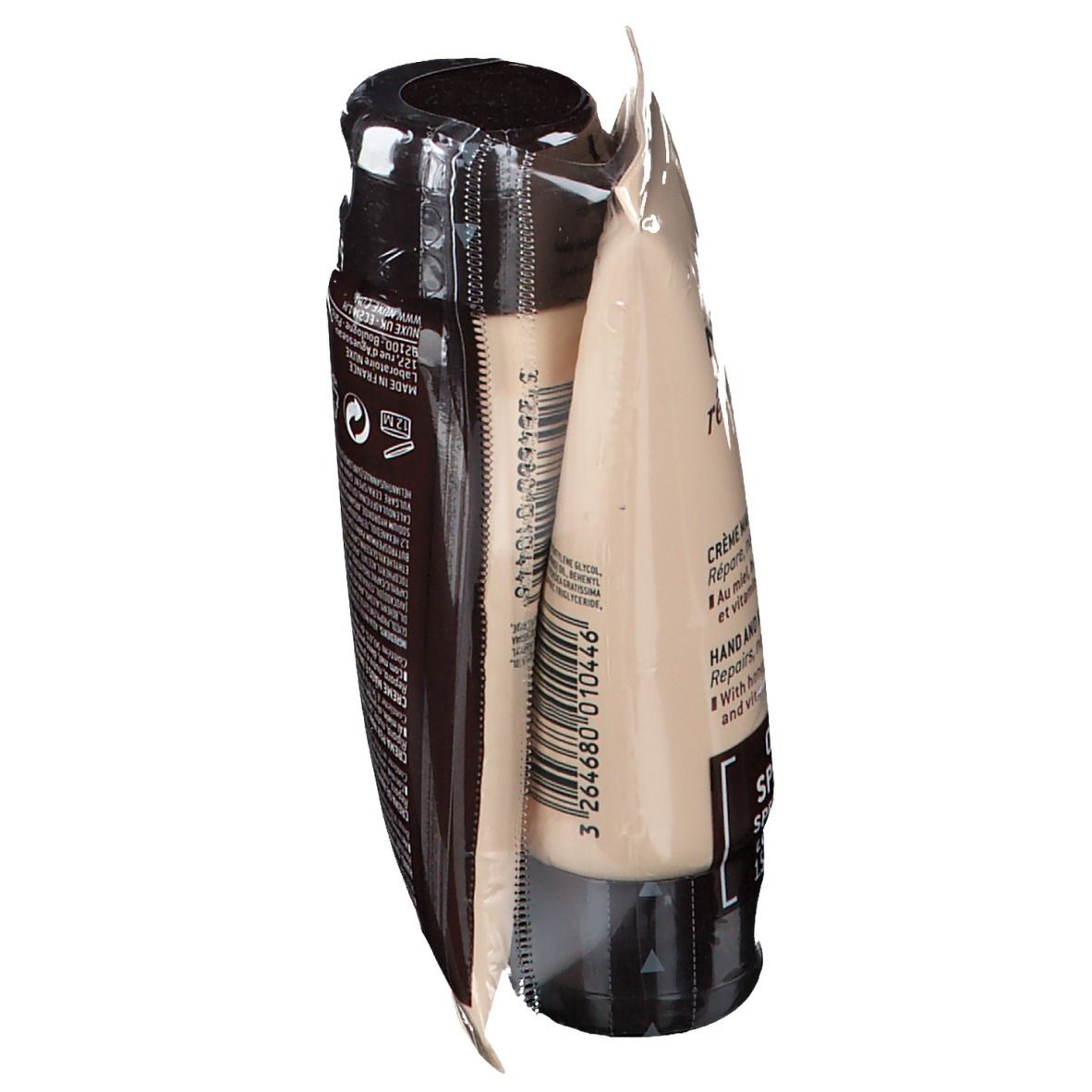 Deux tubes de crème pour les mains dans un emballage transparent. Du texte est visible sur un tube.