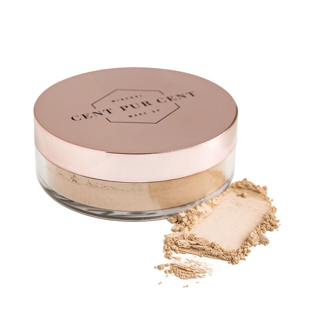 Fond de teint en poudre dans un pot transparent avec couvercle rose. Marque : Cent Pur Cent.