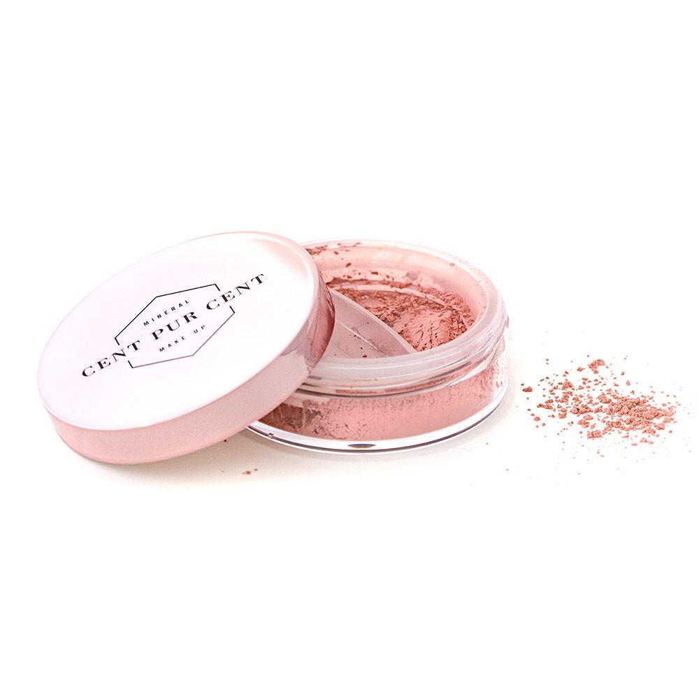 Récipient de poudre rose lâche, couvercle à côté. Logo sur le couvercle.