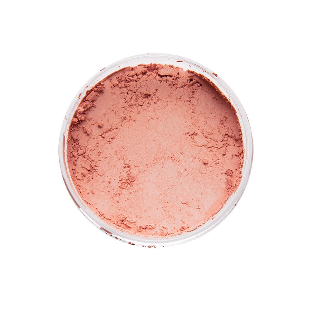 Récipient rond de poudre rose lâche. Vue de dessus.