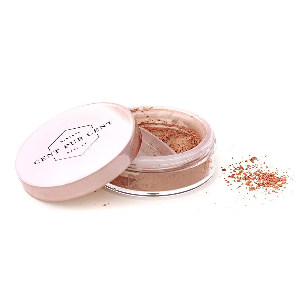 Récipient ouvert avec poudre bronze et applicateur. Inscription : CENT PUR CENT.