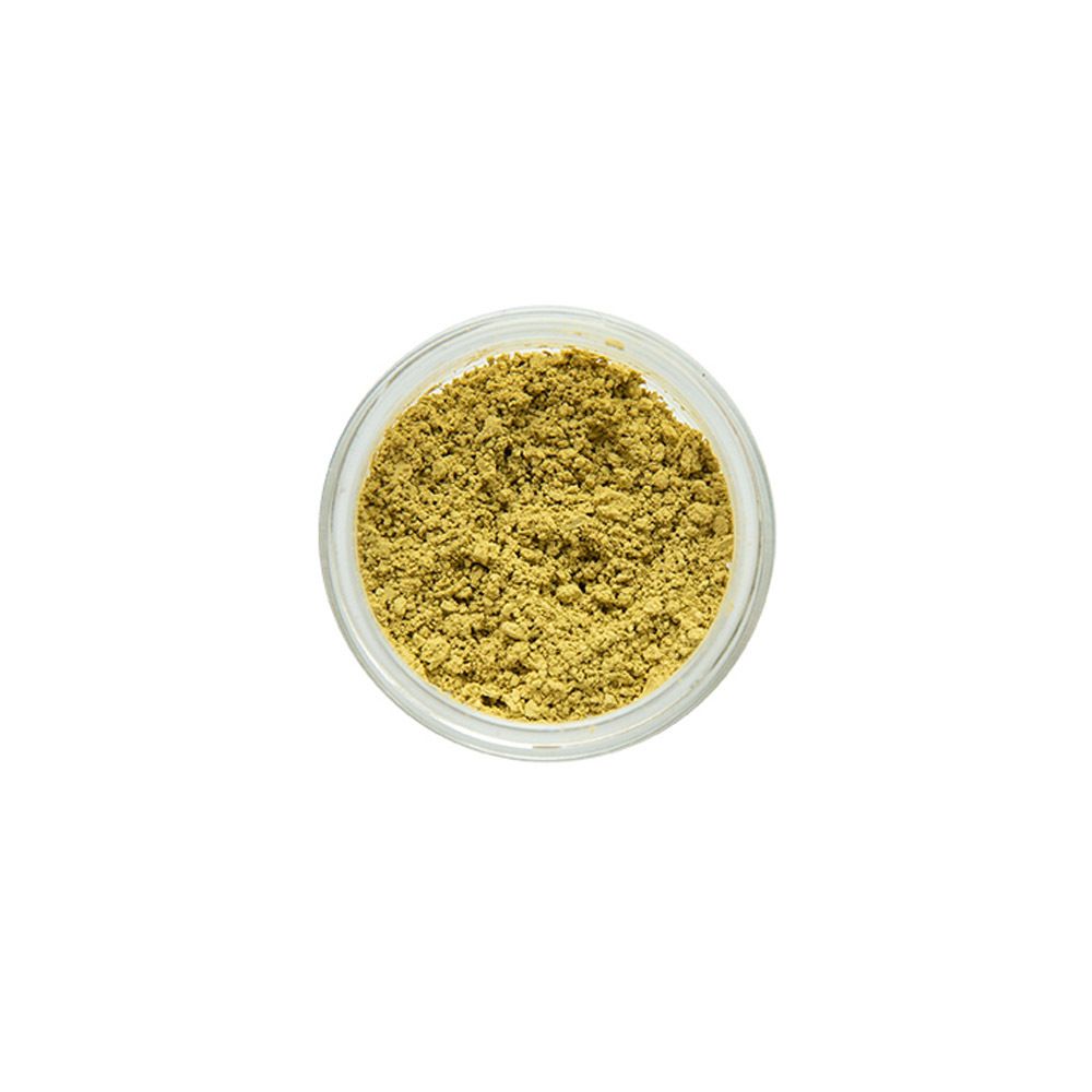 Vue de dessus d'un pot de fard à paupières jaune-vert.