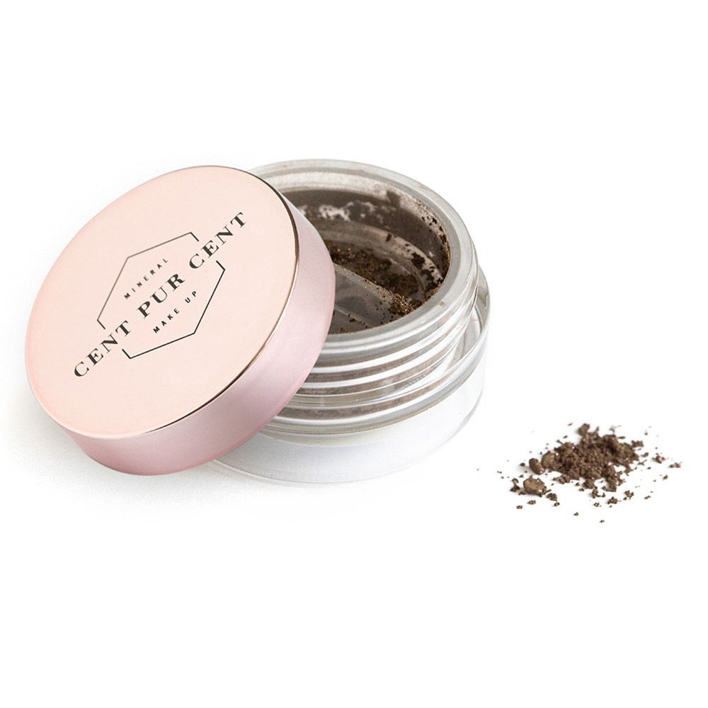 Pot de fard à paupières minéral. Couvercle rose avec logo. Tas de poudre à côté.
