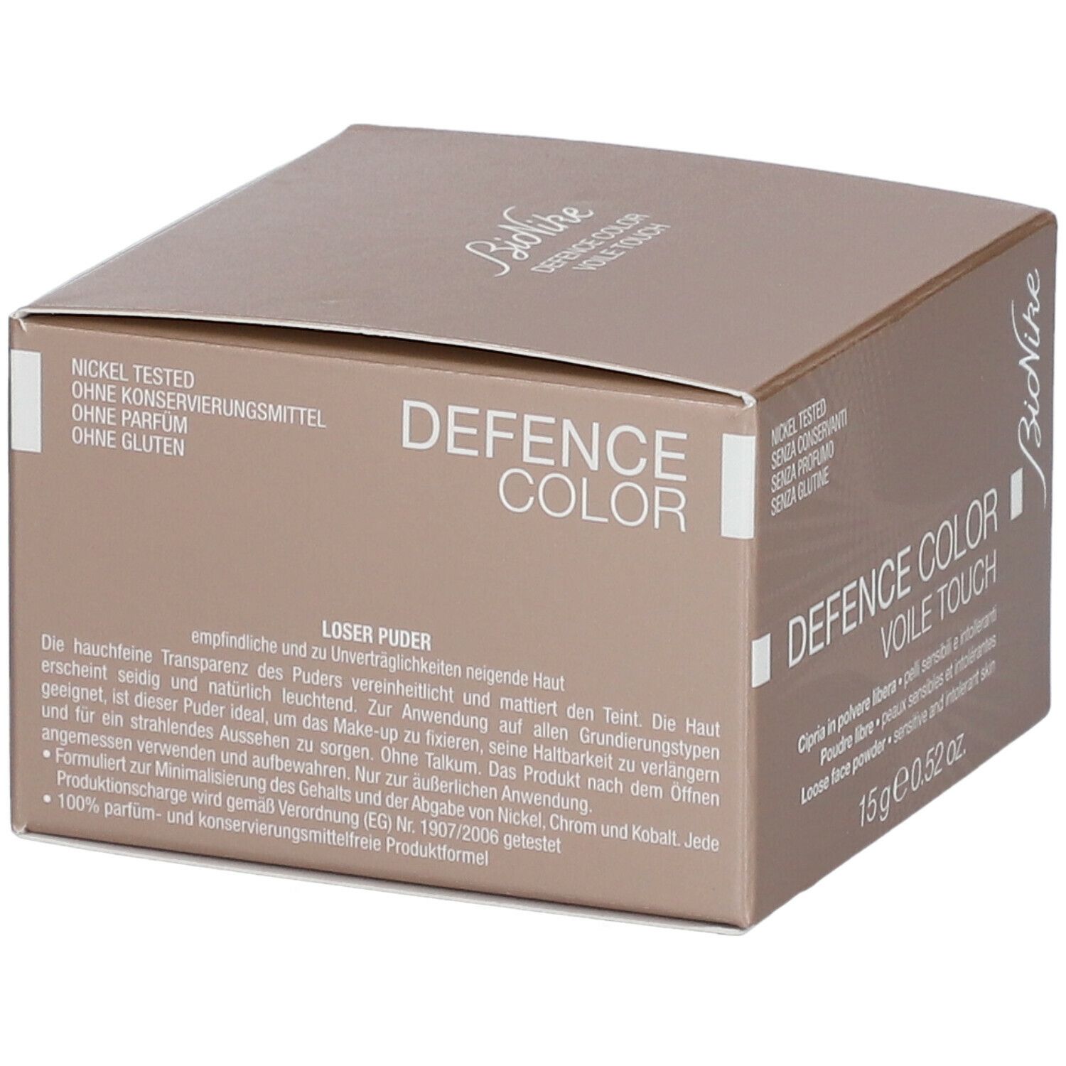 Braune Kartonverpackung mit Produktinformationen. Aufschrift: DEFENCE COLOR VOILE TOUCH. 15 g.