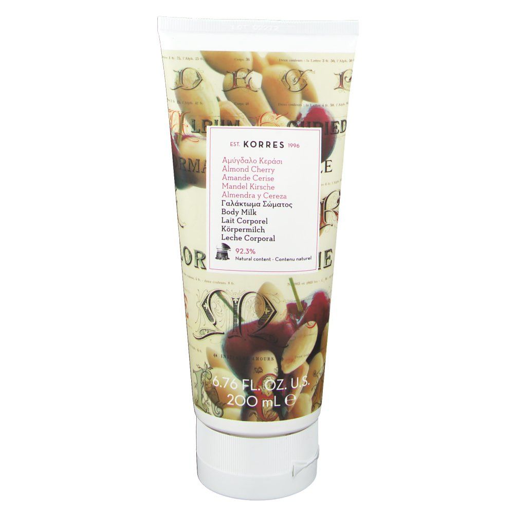 Körperlotion-Tube mit Mandel- und Kirsch-Motiven. Enthält Text in mehreren Sprachen, darunter "Körperlotion".