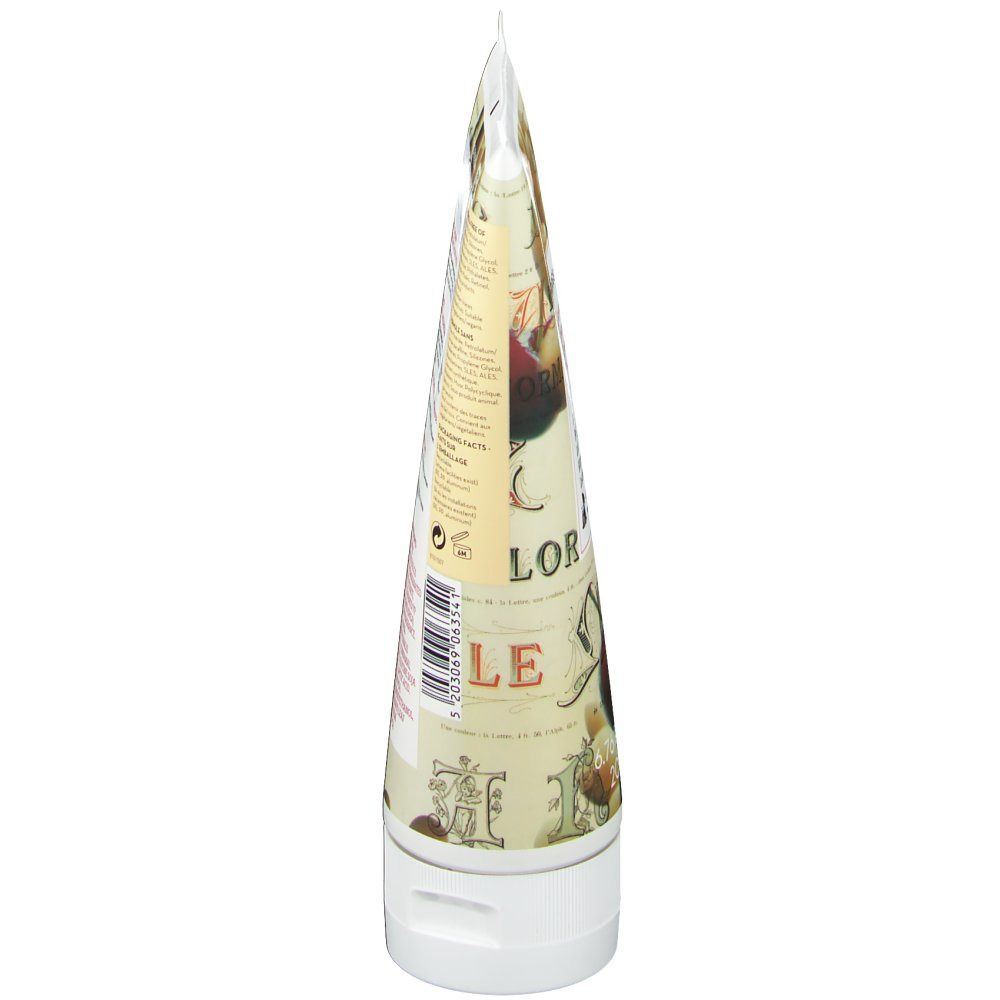 Seitenansicht der Körperlotion-Tube. Weiße Kappe, spitz zulaufende Form. Bedruckt mit Mandel- und Kirsch-Motiven.