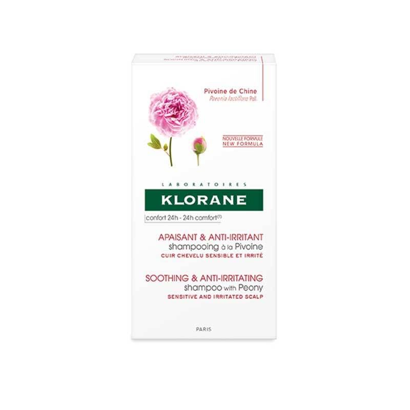 Emballage blanc du produit avec logo, nom du produit et illustration de pivoine. Texte en allemand et anglais. Nouvelle formule.
