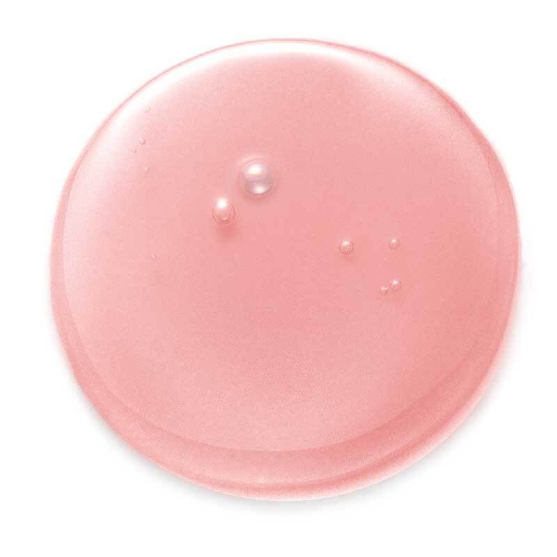 Goutte de shampooing rose, ronde, avec bulles transparentes sur fond blanc. Gros plan.