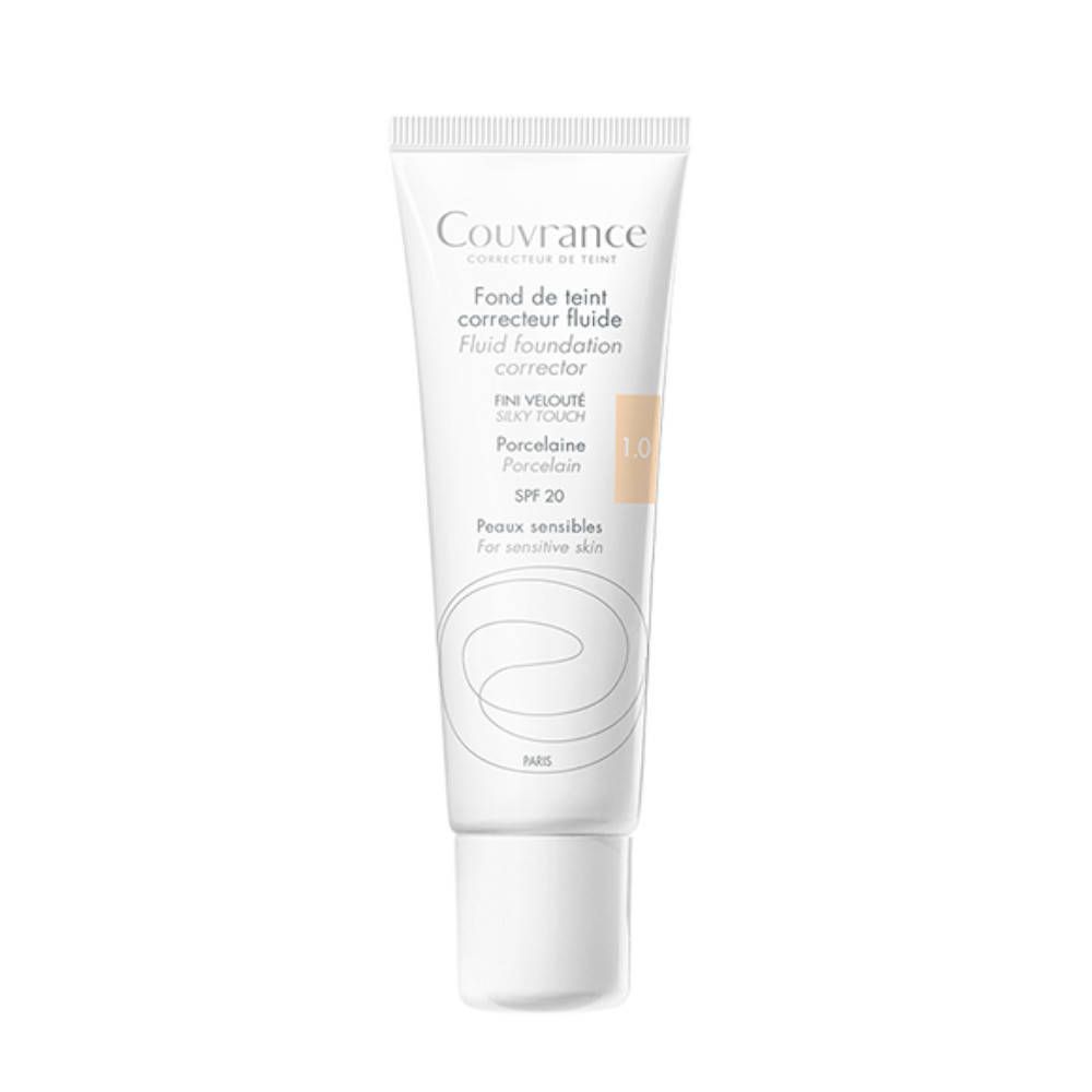 Fond de teint correcteur fluide. Tube blanc avec texte. Teinte 1.0 Porcelaine. Peaux sensibles. SPF 20.