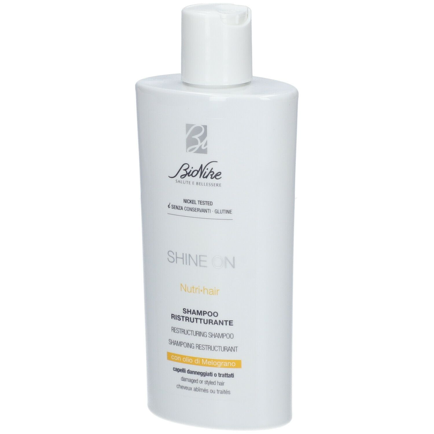 Witte shampoo fles met witte dop. Opschrift: Bionike, Shine On, Nutri-hair, Shampoo Ristrutturante.