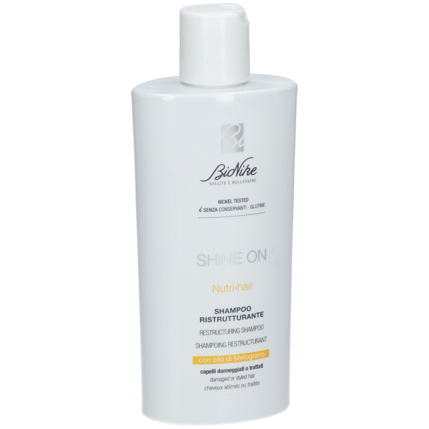 Witte shampoo fles met witte dop. Opschrift: Bionike, Shine On, Nutri-hair, Shampoo Ristrutturante.
