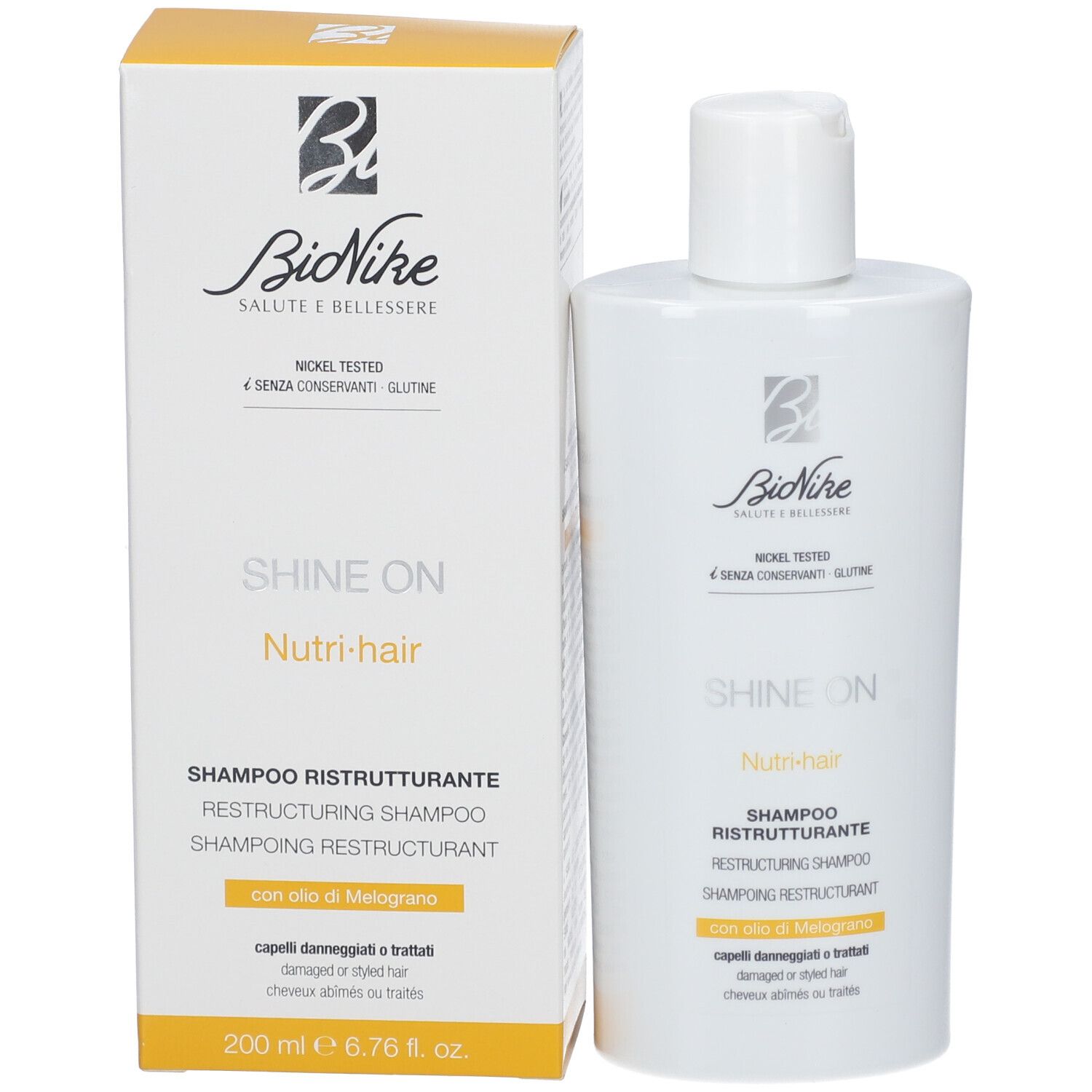 Shampoo fles en doos. Opschrift: Bionike, Shine On, Nutri-hair, Shampoo Ristrutturante. Volume: 200 ml.